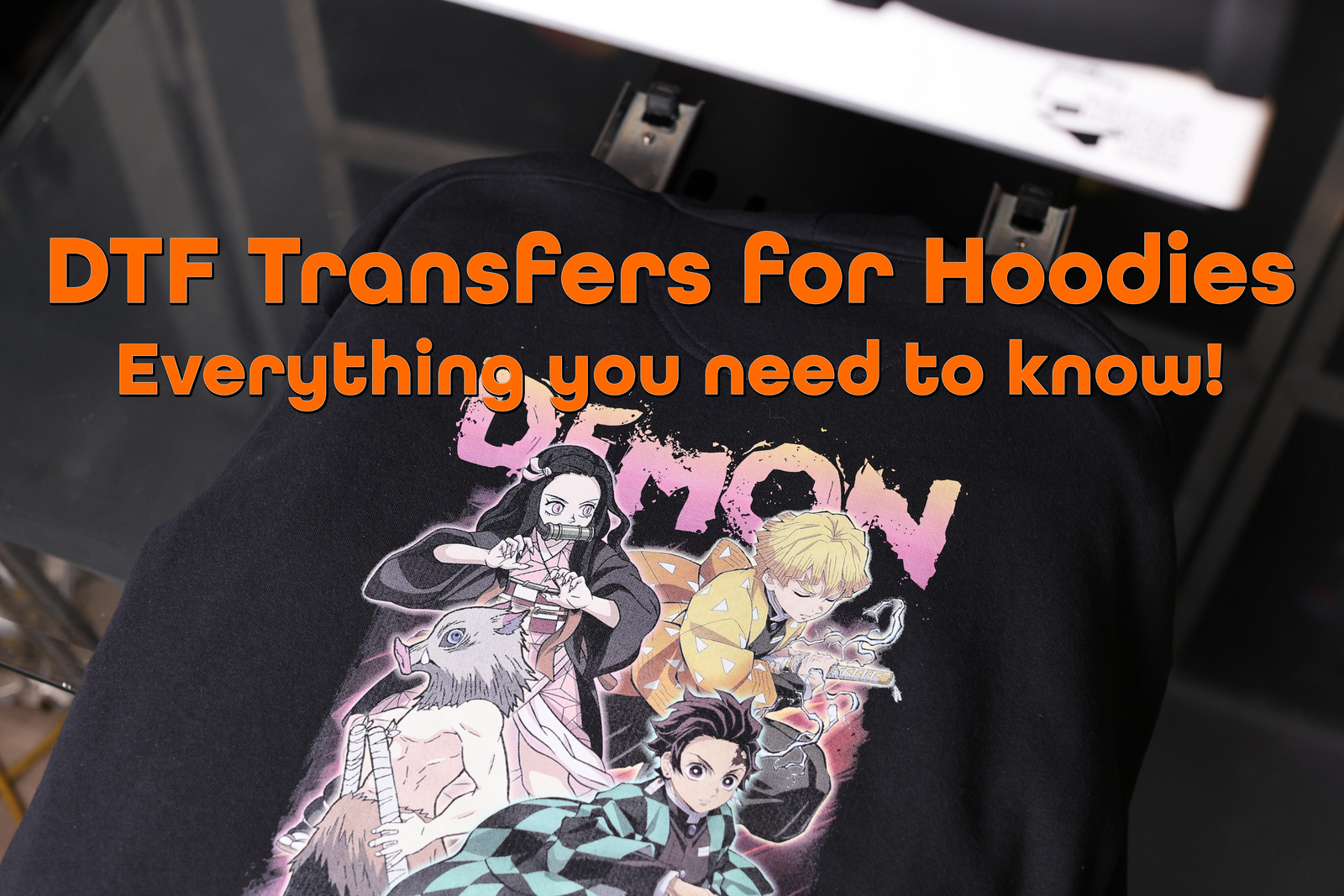 Custom DTF transfer design heat-pressed onto a black pullover hoodie
